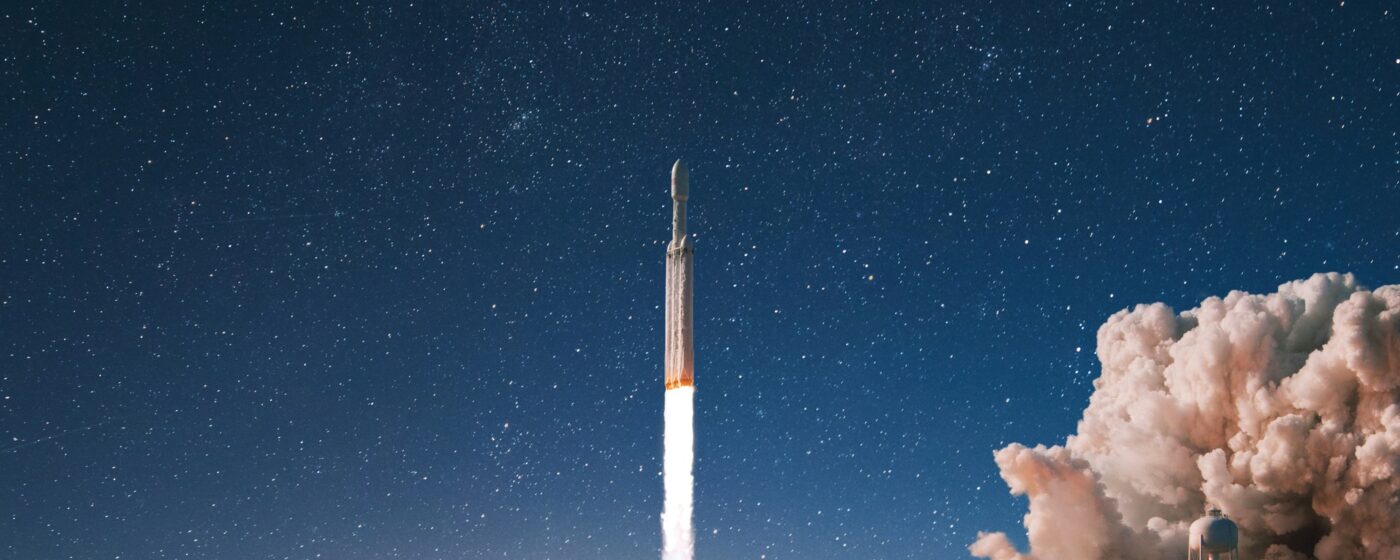 New modern rocket with smoke and blast successfully lift off into the starry sky